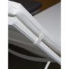 NAUTIC sun lounger cushion by Ezpeleta in white placed on a white chaise longue, where you can see how it attaches to it with the back strap of the cushion