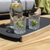 Luz tray with teak edges and aluminium base. On a teak table.