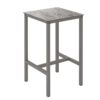 mesa urban 70 x 70 es una mesa alta con reposapiés con la estructura en taupe y el tablero imitando la piedra