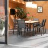 SOUTH WALLES extendable table, aluminium frame painted in anthracite and teak tabletop.