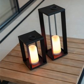 SIROCO portable metal lantern, on a low wooden table