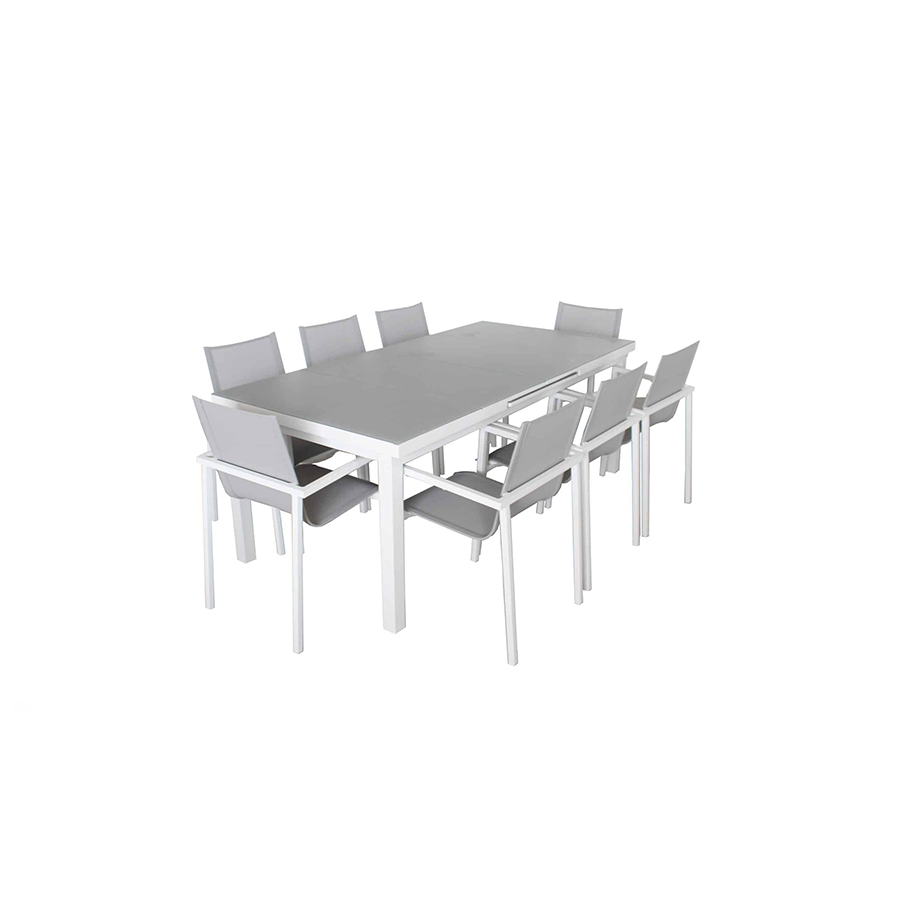 mesa extensible ALOHA cerrada con 8 sillas con la estructura en blanca, vista oblicua, sobre fondo blanco