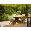 Delphine Esmeralda 5 chairs around the Provence table photo environment, On a terrace with grey ceramic flooring and on a redocda esparto rug
