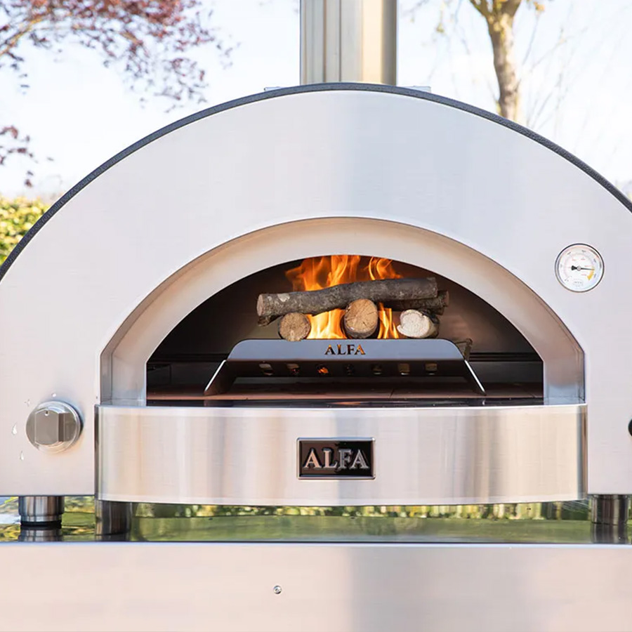 CLASSICO 4 Pizze hybrid, ambient photo front view of the oven being lit with firewood