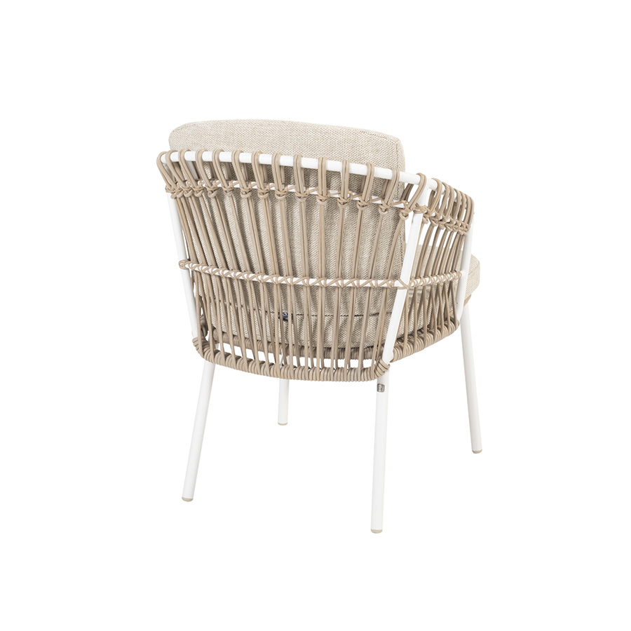 DALIAS Chair - 4 Seasons Outoor® includes seat and back cushions in beige and tan beige. Chair with a white tubular steel structure, embellished with hand-woven hularo wicker around the structure in a toasted beige tone imitating traditional wicker. Rear view on white background.