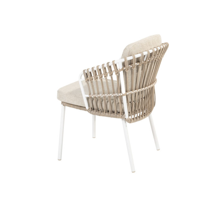 DALIAS Chair - 4 Seasons Outoor® includes seat and back cushions in beige and tan beige. Chair with a white tubular steel structure, embellished with hand-woven hularo wicker around the structure in a toasted beige tone imitating traditional wicker. Left side view on white background.