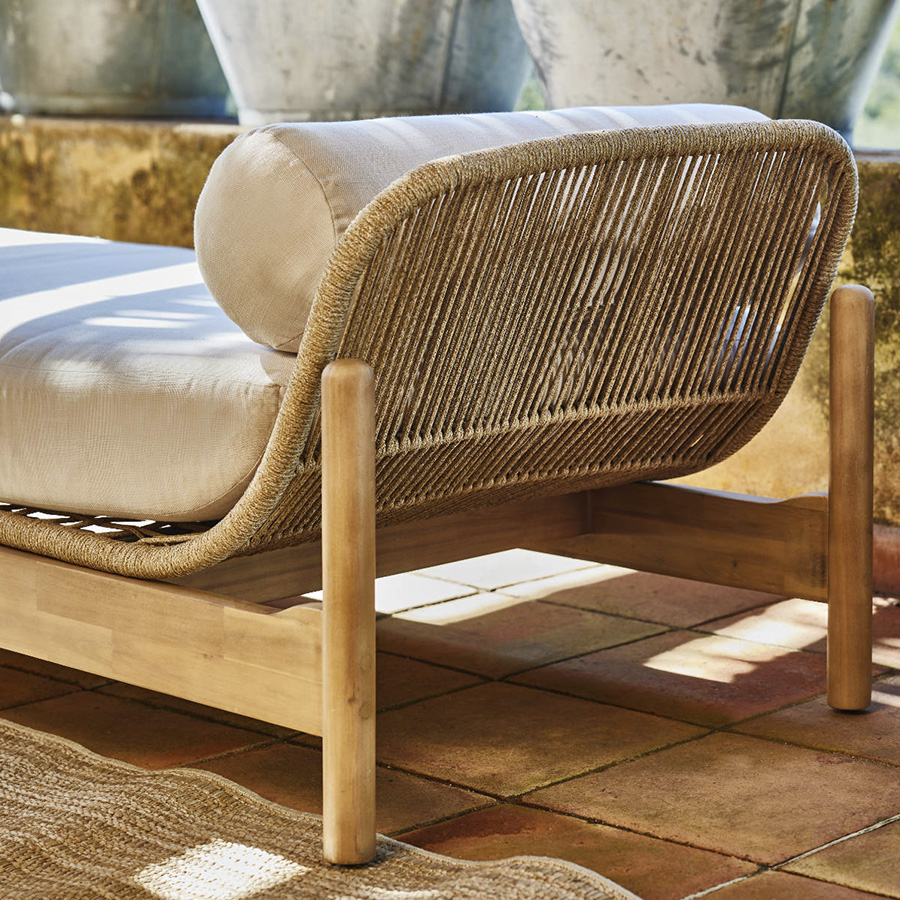 TALARA daybed by GardenLine® ambient photo oblique view detail of the right side acacia structure and roped with beige cushions