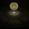 Lumiz Round 40 TIGRES Yellow Solar Lantern, illuminates and decorates your garden with De Tropen. Photo of the dark environment to see the reflections created by the pattern.