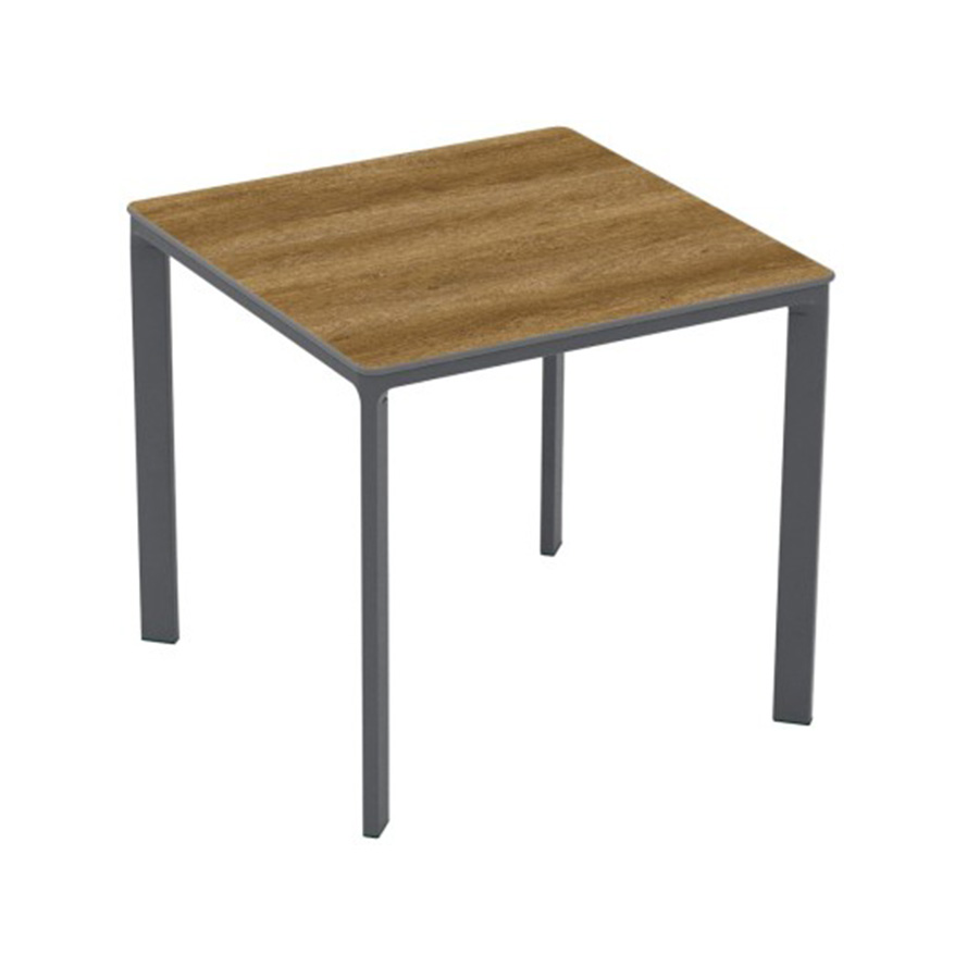 Meet Table by Ezpeleta 80x80cm With an anthracite aluminium structure and a dark oak HPL top. Suitable for indoor and outdoor use, both for public and residential settings. Find it at De Tropen, your outdoor furniture expert. Oblique front view