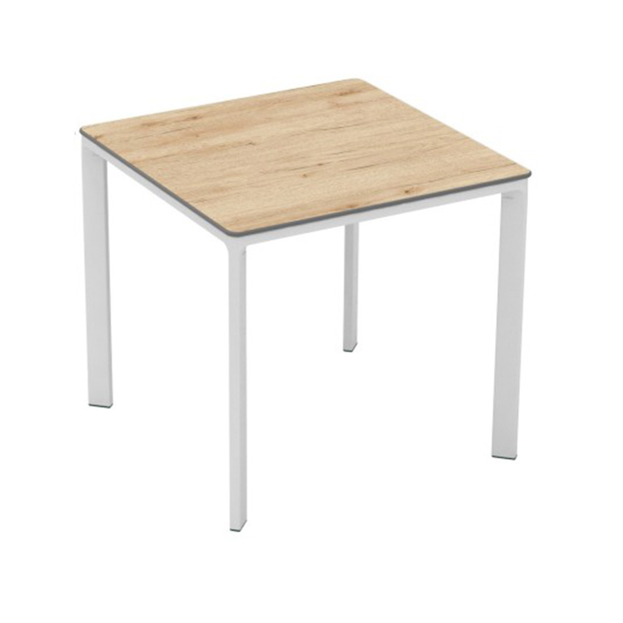 Meet Table by Ezpeleta 80x80cm With a white aluminium structure and an oak HPL top. Suitable for indoor and outdoor use, both for public and residential settings. Find it at De Tropen, your outdoor furniture expert. Oblique front view