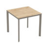 Meet Table by Ezpeleta 80x80cm With a taupe aluminium structure and an oak HPL top. Suitable for indoor and outdoor use, both for public and residential settings. Find it at De Tropen, your outdoor furniture expert. Oblique front view