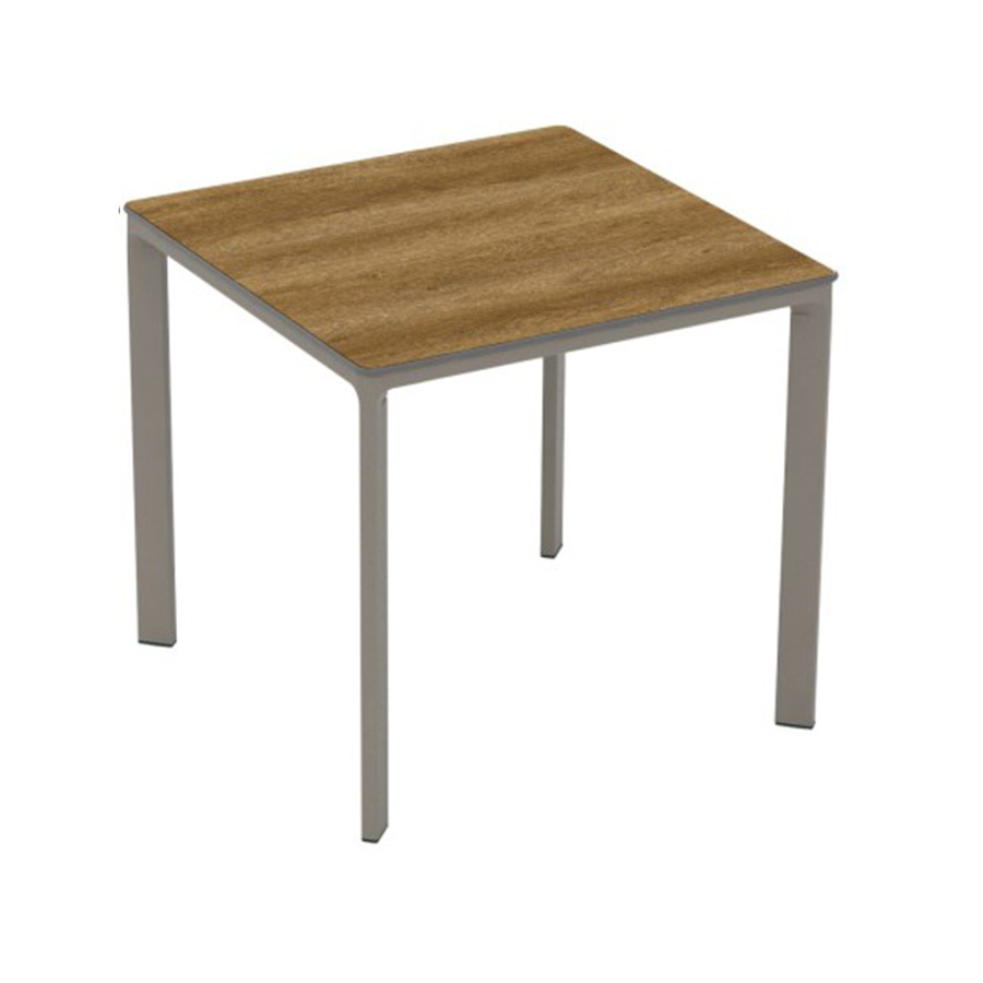 Meet Table by Ezpeleta 80x80cm With a taupe aluminium structure and a dark oak HPL top. Suitable for indoor and outdoor use, both for public and residential settings. Find it at De Tropen, your outdoor furniture expert. Oblique front view