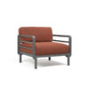 Maximo armchair by Nardi. A garden armchair with clean, modern lines, combining 4 colours of regenerated fiberglass-reinforced polypropylene resin frame with 4 colours of Sunbrella fabric, also made from recycled material. A clear statement of intent to care for the planet and beautify your outdoor space. Oblique front view. Secure online purchase and fast shipping with De Tropen.