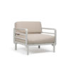 Maximo armchair by Nardi. A garden armchair with clean, modern lines, combining 4 colours of regenerated fiberglass-reinforced polypropylene resin frame with 4 colours of Sunbrella fabric, also made from recycled material. A clear statement of intent to care for the planet and beautify your outdoor space. Oblique front view. Secure online purchase and fast shipping with De Tropen.