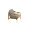 The Nora teak armchair by 4SO features an ergonomic, rounded teak frame embellished with taupe rope knotted from the armrests to the seat base, creating a signature pattern of the Nora collection. Both the legs and the frame are cylindrical and smooth. The chair includes both seat and back cushions in different shades of toasted beige. Purchase it at De Tropen, your expert in garden and patio furniture. Front view of the armchair against a white background.