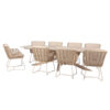 Prado Barrel Fabrice Dining Set by 4 Seasons Outdoor. Front view of the dining set at an angle shows the Prado Barrel 300 table with a barrel-shaped ceramic top and crossed stainless steel legs finished in latte. It is surrounded by eight Fabrice chairs made of stainless steel and finished in a latte color (coffee with milk or toasted beige, a trending color for 2026). They are embellished with rope in different shades of beige knotted to the frame. Buy it at De Tropen, your expert in garden and patio furniture. Front view of the dining set at an angle against a white background.