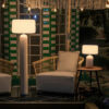 Phoebe 40 and 145 solar table lamps in white by NewGarden, lifestyle photo, one on each side of an armchair, on the right the Phoebe 40 on a side table and on the left the 145 standing. Expand your horizons with De Tropen®, come and discover the possibilities of lighting for your terrace or balcony. In the largest garden furniture store on the Costa del Sol, Málaga and Granada.